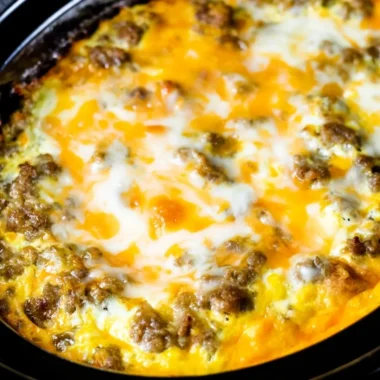 Cheesy Sausage Hashbrown breakfast served on a plate with garnishes