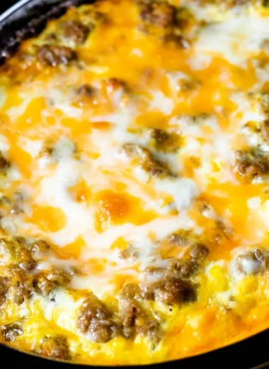 Cheesy Sausage Hashbrown breakfast served on a plate with garnishes