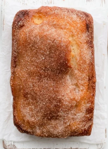 Cinnamon Sugar Donut Bread fresh out of the oven, topped with a sprinkle of cinnamon sugar.