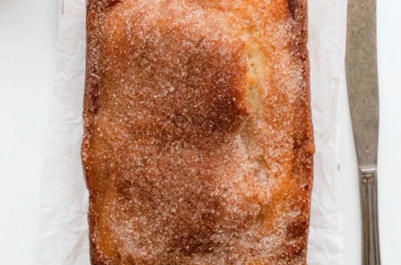 Cinnamon Sugar Donut Bread fresh out of the oven, topped with a sprinkle of cinnamon sugar.
