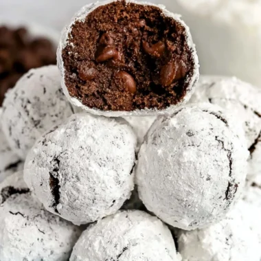 Freshly baked Double Chocolate Snowball Cookies dusted with powdered sugar