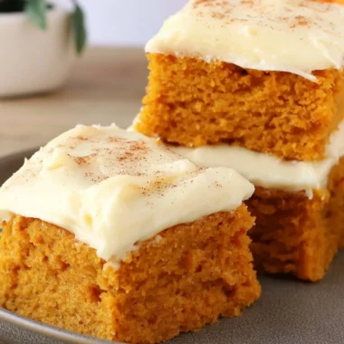 Delicious Paula Deen pumpkin bars displayed on a plate.