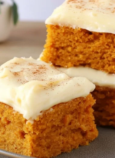 Delicious Paula Deen pumpkin bars displayed on a plate.