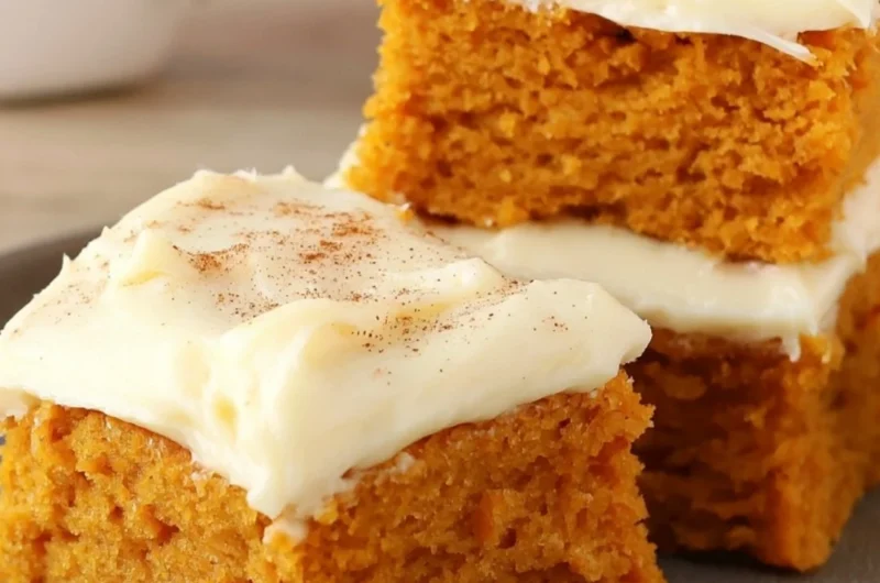 Delicious Paula Deen pumpkin bars displayed on a plate.