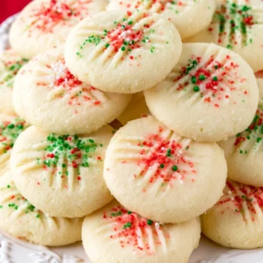 Delicious whipped shortbread cookies on a plate, perfect for any occasion.