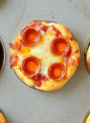 Plate of delicious Deep Dish Mini Pizzas topped with cheese and fresh ingredients.