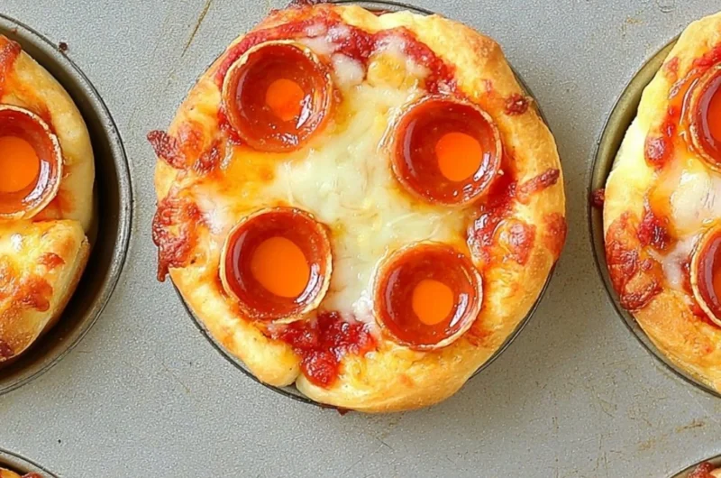 Plate of delicious Deep Dish Mini Pizzas topped with cheese and fresh ingredients.