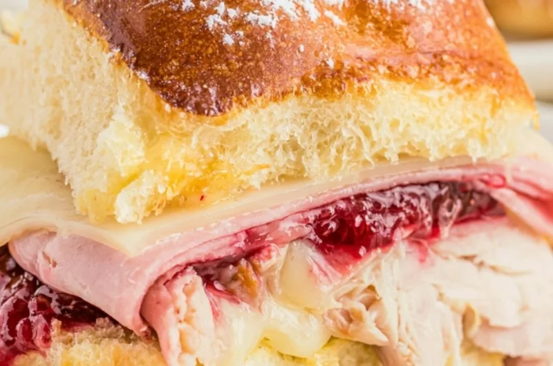 Delicious easy cheesy Monte Cristo sliders ready to serve on a platter.