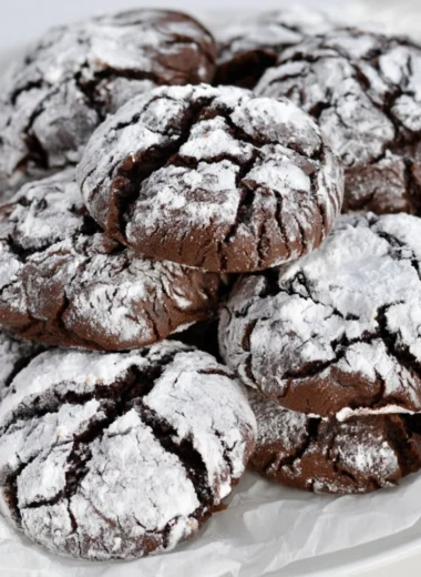 Baking easy chocolate crinkle cookies with powdered sugar coating.