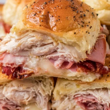 Buttery baked club sliders fresh out of the oven, ready to be served as a tasty snack.