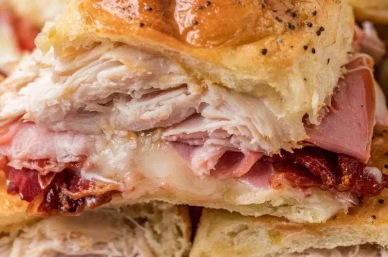 Buttery baked club sliders fresh out of the oven, ready to be served as a tasty snack.