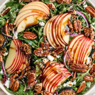 Fresh Apple Arugula Salad with slices of apple and arugula leaves