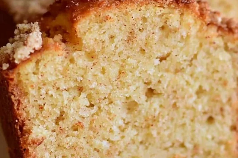 Delicious spiced Eggnog Loaf garnished with holiday spices and a dusting of powdered sugar.