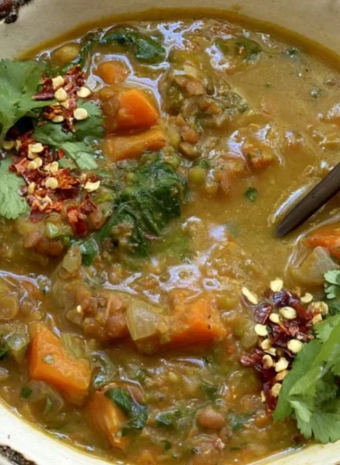 Bowl of sweet potato lentil stew with vibrant vegetables and spices