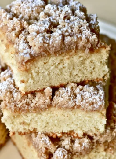 Delicious slice of New York Crumb Cake with a fluffy crumb topping