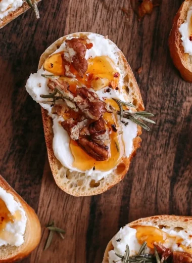 Whipped feta crostini drizzled with hot honey, a delicious appetizer.